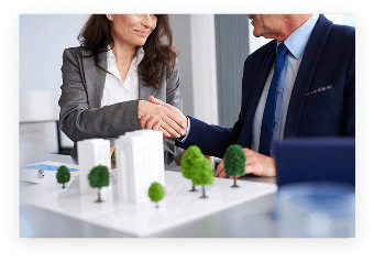 Business professionals shaking hands during a successful deal